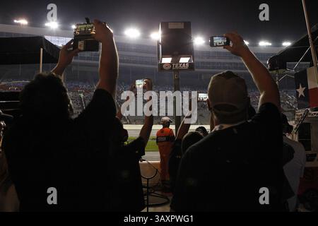 November 4, 2016 - Fort Worth, TX, USA - Fans along pit row make cell phone photos during pit stops during the 18th Annual Striping Technology 350, part of the NASCAR Camping World World Truck Series, at Texas Motor Speedway in Fort Worth, Texas, on Friday, Nov. 4, 2016. (Credit Image: © Paul Moseley/TNS via ZUMA Wire) Stock Photo