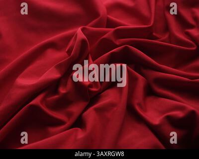 A red wrinkled fabric texture background. Close up. Stock Photo