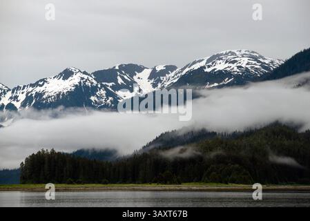 Jun 30, 2016 - Juneau, Alaska, U.S. - Landscape of Scenery Cove, Thomas Bay, Petersburg, Southeast Alaska. Thomas Bay is located in southeast Alaska. It lies northeast of Petersburg, Alaska and the Baird Glacier drains into the bay. Thomas Bay is also known as 'The Bay of Death' due to a massive landslide in 1750. It also has gained the name of 'Devil's Country' when in 1900 several people claimed to have seen devil creatures in the area. Thomas Bay is known for being rich in gold and quartz. The wildlife has moose, brown bears, black bears, squirrels, wolves, rabbits, and other common Alaskan Stock Photo