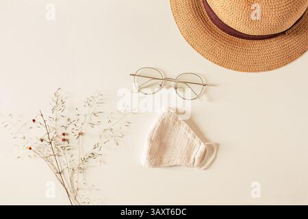 Springtime concept. Composition with eyeglasses, hat and mask  on a white background. Spring mock up. Flat lay, top view. Stock Photo