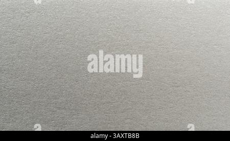 Light gray paper features smooth, subtle texture that highlights its minimalist aesthetic and elegant design. Stock Photo