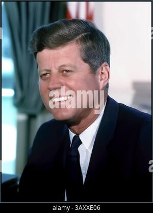 JFK 1963 President John F. Kennedy, smiling relaxed portrait photograph seated in the Oval Office.White House Date 11 July 1963 (credit Cecil Stoughton), White House USA Stock Photo