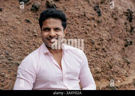 Portrait of an happy Indian man smiling and looking at the camera, photo with copy space. Stock Photo
