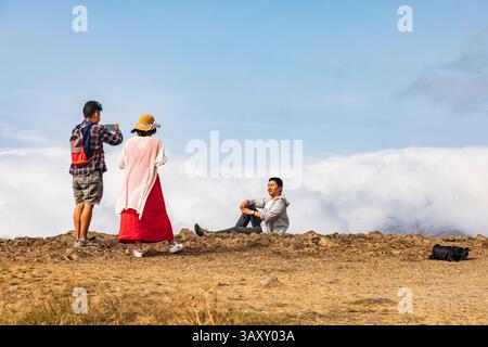 August 15, 2018. Western Asia, Eurasia, South Caucasus, Republic of Armenia. Sevan. Tourists taking photos at the Sevanavank Monastery complex on Lake Stock Photo