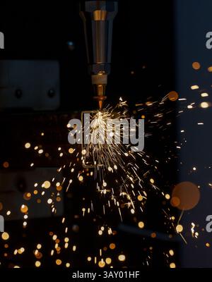 a sparks when cutting metal, laser cutting of metal on a machine, automated metal cutting Stock Photo