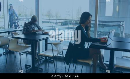 Flat design business scene is showing people working at cafe tables with laptop and smartphone Stock Photo