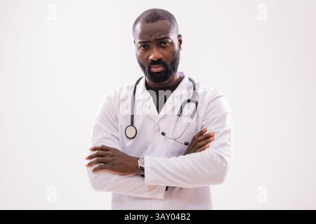 Portrait of black male healthcare worker with serious expression, exhausted from working. Stock Photo
