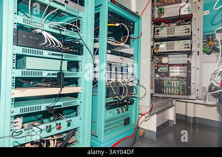 Server cabinet in the server room, with microchips and wires. Stock Photo