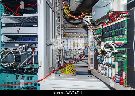 Antwerp, Belgium - 30.09.2023: Server cabinet in the server room, with microchips and wires. Stock Photo