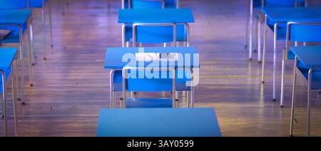 Empty classroom with blue desks and chairs 3d Stock Photo