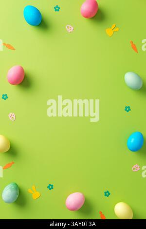 Happy Easter vertical banner template. Colorful Easter eggs and festive decorations on a vibrant green background. Stock Photo