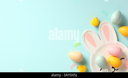 Happy Easter banner. Easter eggs and plate in form of Easter bunny on blue background. Stock Photo