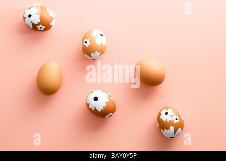 Creative layout with Easter eggs on pastel pink background. Happy Easter card. Stock Photo