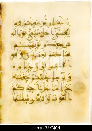 A folio from a Qur'an manuscript featuring intricate script and ...