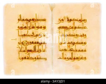 This Qur'an manuscript folio features Arabic calligraphy and ornamental ...