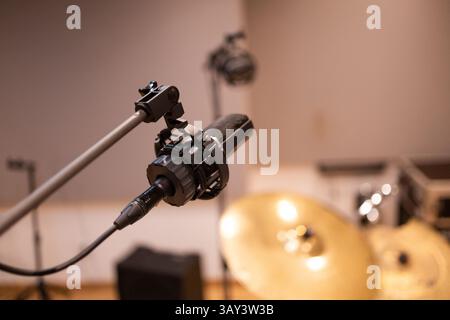 Close-up of a professional microphone in a recording studio, focusing on audio equipment for music production. Ideal for sound, music, and technology Stock Photo