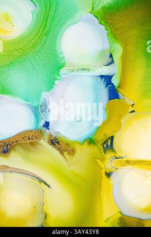 Stunning abstract art displaying a fluid mix of vibrant yellow and green hues with details in blue and white. This high-resolution image captures the Stock Photo