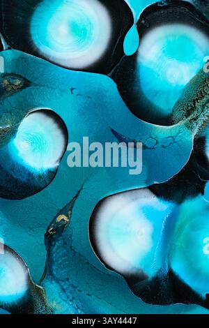 Close up of abstract blue liquid art with captivating swirling patterns, textures, and gradients. The liquids forms and vibrant hues create a mesmeriz Stock Photo