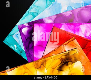A collection of vibrant abstract ink backgrounds showcasing various vivid colors on paper. Perfect for creative designs, these textures highlight flui Stock Photo