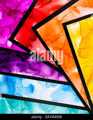 A stunning composition showcases layers of multicolored ink wash art creating a vibrant, abstract visual. Bold pink, red, orange, and blue hues merge Stock Photo