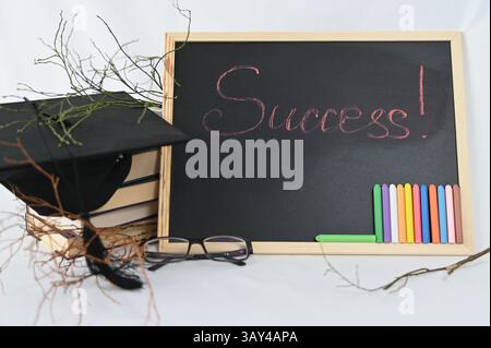On a blackboard, the word SUCCESS is prominently and beautifully written out, showcasing determination and achievement with style Stock Photo