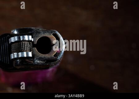 An old used hand cigarette lighter Stock Photo