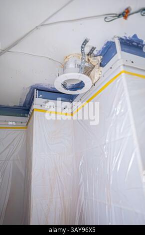 Stretch ceiling Installation in Progress in Bathroom. Stock Photo