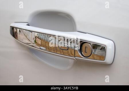 Car door handle with proximity activated open button for keyless entry Stock Photo