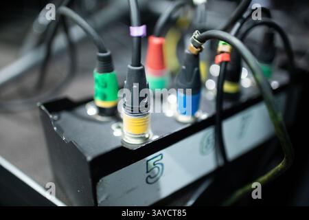 Detailed CloseUp View of Various Audio and Video Connection Ports along with Cables Stock Photo