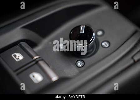 Close Up of Luxury Car Interior Control Panel with Rotary Knob Stock Photo
