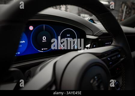 Close Up of Porsche Macan Digital Dashboard and Steering Wheel Stock Photo