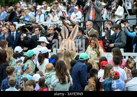 Washington, United States. 21st Apr, 2025. U.S First Lady Melania Trump, alongside the Easter Bunny, greets visitors during the start the annual White House Easter Egg Roll on the South Lawn of the White House, April 21, 2025 in Washington, DC Credit: Joyce Boghosian/White House Photo/Ģ����ý Live News Stock Photo