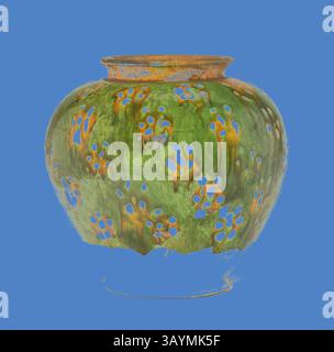 A decorative vase showcasing an intricate design with vibrant floral patterns and a unique textured surface, featuring hues of green and accents of orange and blue. The rounded shape and artistic detailing create a striking focal point. Ovoid Jar with Blossom-Like Spotting, Tang dynasty (618–906), first half of 8th century, China, Earthenware with three-color (sancai) lead glazes and resist decoration, H. 16.5 cm (6 1/2 in.), diam. 17.4 cm (6 13/16 in.)  Classic art with a modern twist reimagined by Artotop Stock Photo