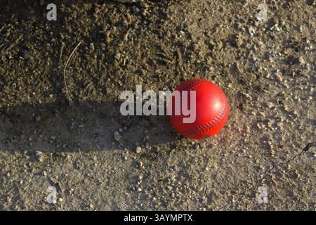 red baseball with navy stitching Stock Photo