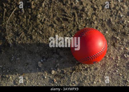 red baseball with navy stitching Stock Photo