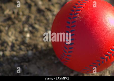 red baseball with navy stitching Stock Photo