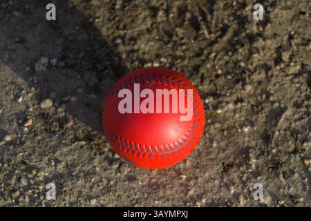 red baseball with navy stitching Stock Photo
