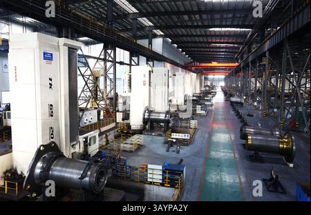 Precision Machining of Wind Turbine Main Shafts Using Boring Machines in Manufacturing Facility, China Stock Photo