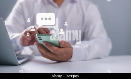 Businessman hand using smartphone typing Live chat chatting and social network concepts, Social media marketing technology concept, Chatting conversat Stock Photo