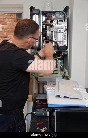 Servicing a modern Worcester gas combi boiler Stock Photo