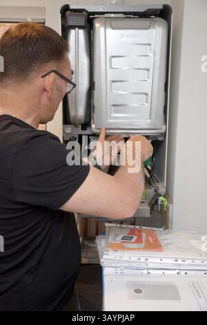 Servicing a modern Worcester gas combi boiler Stock Photo