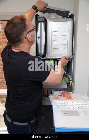 Servicing a modern Worcester gas combi boiler Stock Photo