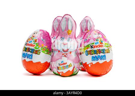 Germany Berlin April 21, 2025. Chocolate eggs and bunnies Kinder Uberraschung on a white background. Festive chocolate. Stock Photo
