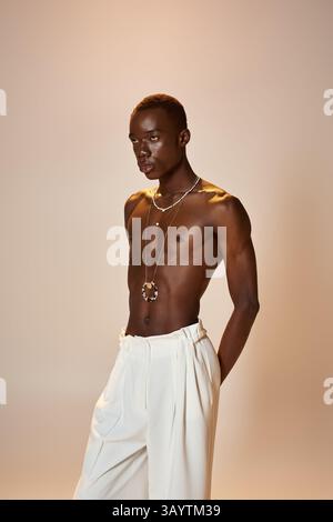 A young african american man exudes charm in stylish attire, posing ...