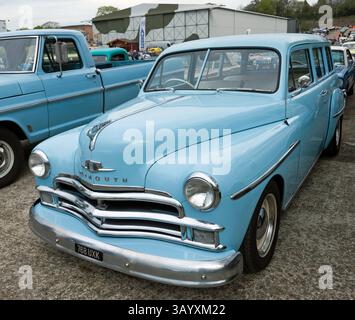 Three-quarters front view of a Blue, 1950 Plymouth Suburban Custom 2-Door Station Wagon, on display at the Brooklands Museum, Easter Classic Gathering Stock Photo