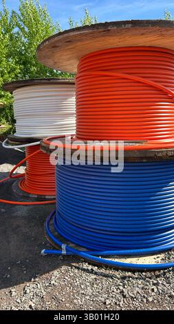various fiber optic cables on the street Stock Photo