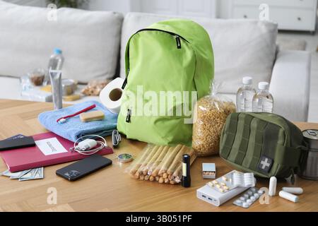 Survival kit. Different emergency supplies on wooden table indoors Stock Photo