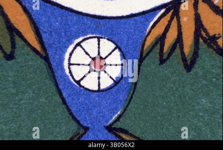 A close-up of a vibrant design featuring a circular pattern with a central red dot, surrounded by a blue element and framed by orange accents. The background is a rich green, emphasizing the colorful details., A vibrant circular design featuring a central motif of a flower encircled by bold colors and stylized foliage, creating an intricate, harmonious pattern. Classic art with a modern twist reimagined by Artotop, Transformed Egyptian Ornament, Classic art with a modern twist reimagined by Artotop Stock Photo