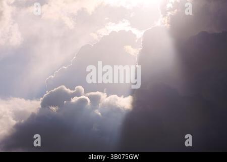 A Dramatic Sky Featuring Radiant Sunlight and Beautiful Clouds in a Peaceful Atmosphere Stock Photo