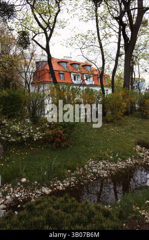 Blossoming trees and pond in Setagaya Park in Vienna, Austria. Stock Photo